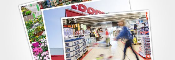 Person mit Einkaufswagen in einem Baumarkt